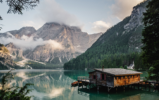 brown-house-near-body-of-water