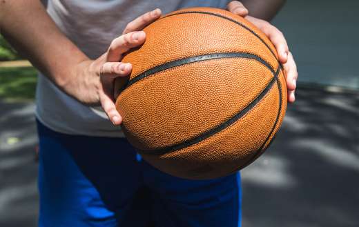 Man holding a ball online
