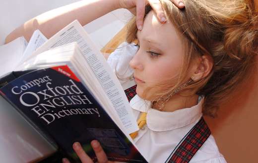 Girl studying puzzle
