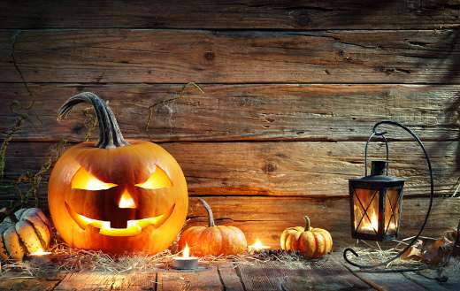 Jack lantern on wooden table with lantern